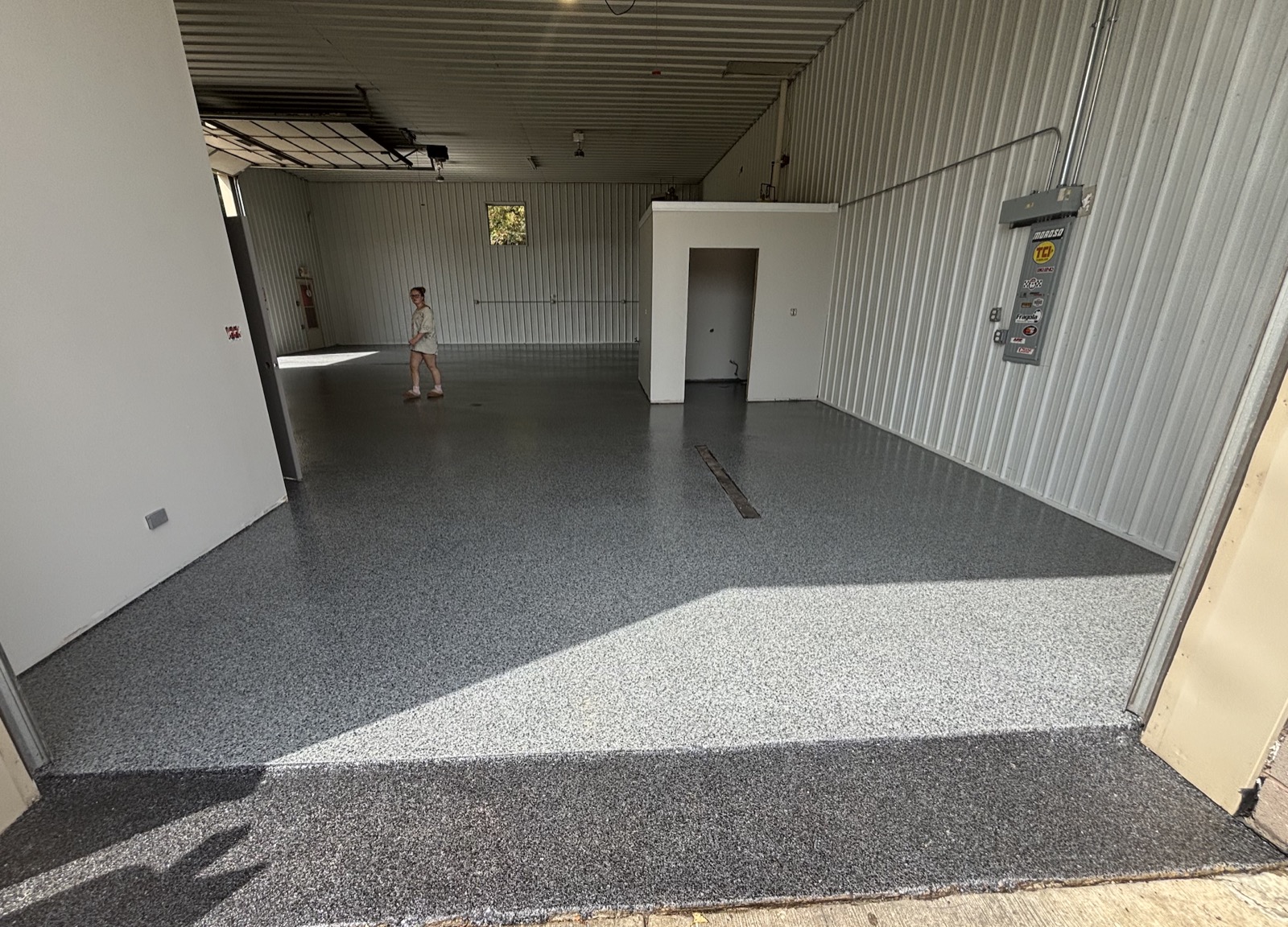 After: finished gray and white flake epoxy garage floor