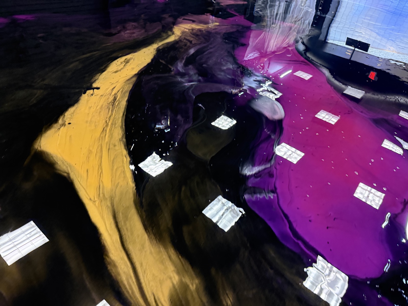 Purple and gold metallic epoxy floor reflection