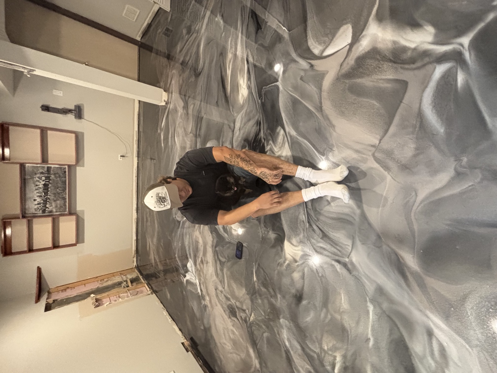 CrossBuilt Coatings owner Gio on a finished metallic epoxy basement floor